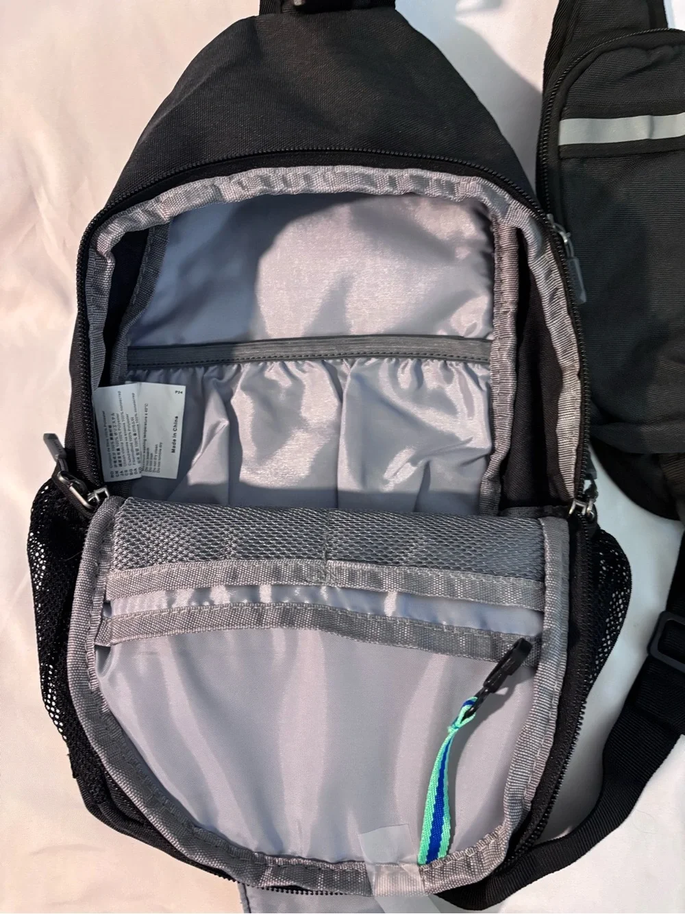 Waterfly Black Sling Backpack Crossbody Travel Bag Side Elastic Mesh Pockets